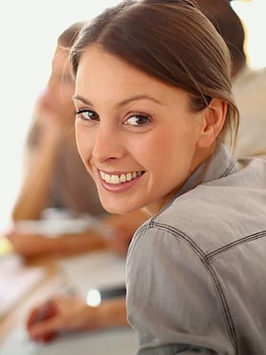 Portrait of smiling working girl in meeting_cropped